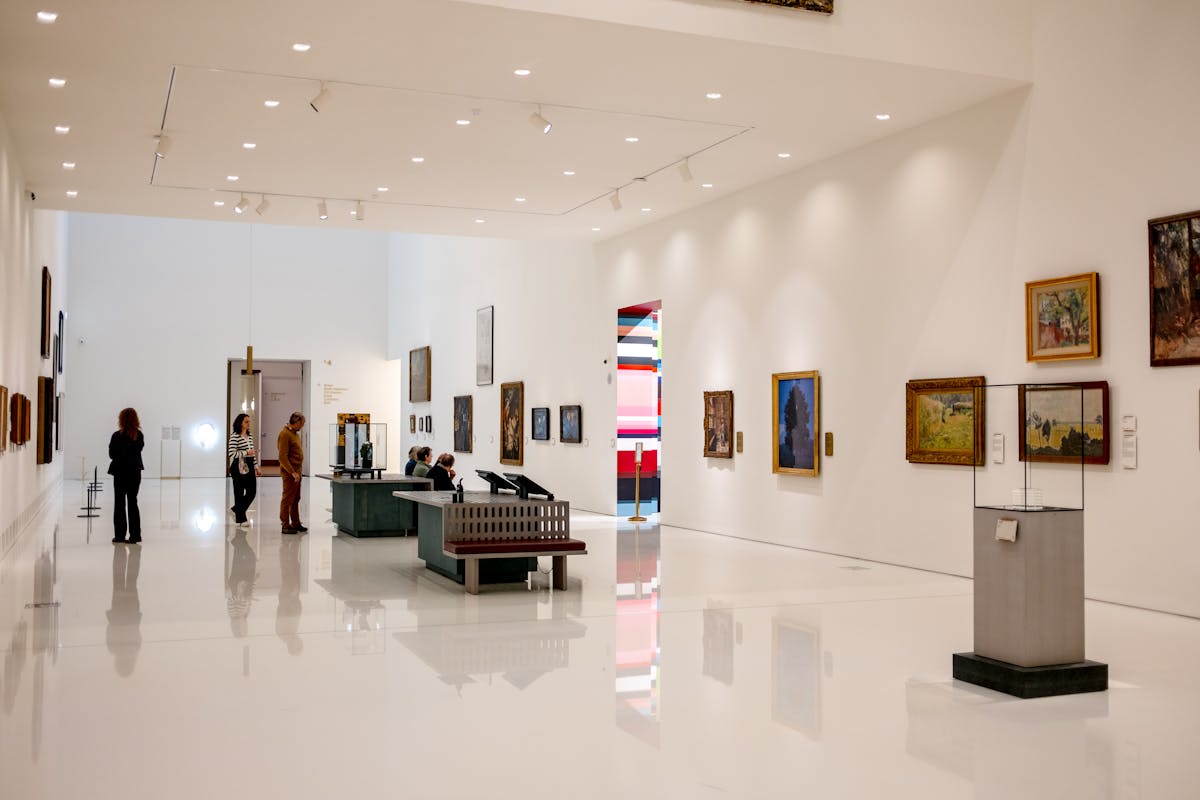 Visitors admiring the rainbow light inside Ellsworth Kelly's Austin at the Blanton Museum