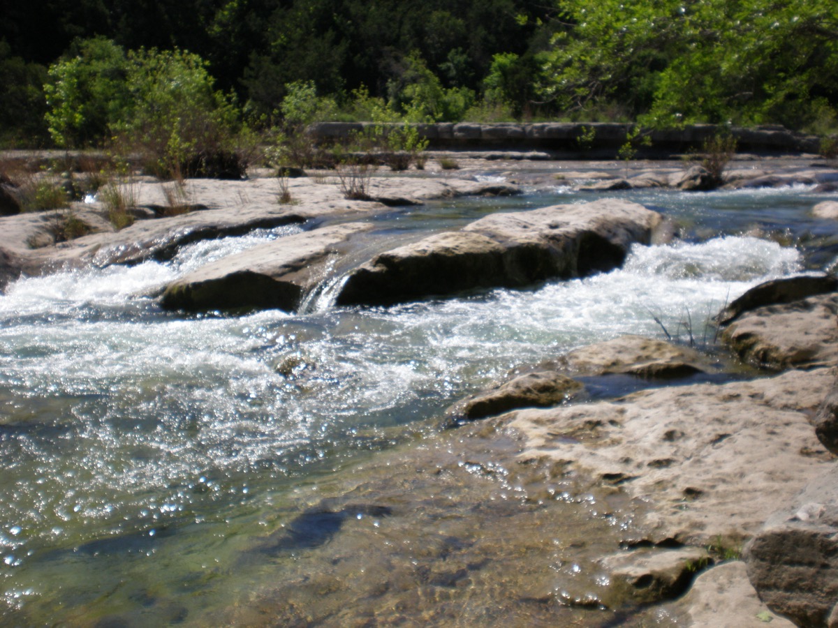 Barton Creek Greenbelt hiking trail with limestone cliffs and natural swimming holes just minutes from downtown Austin